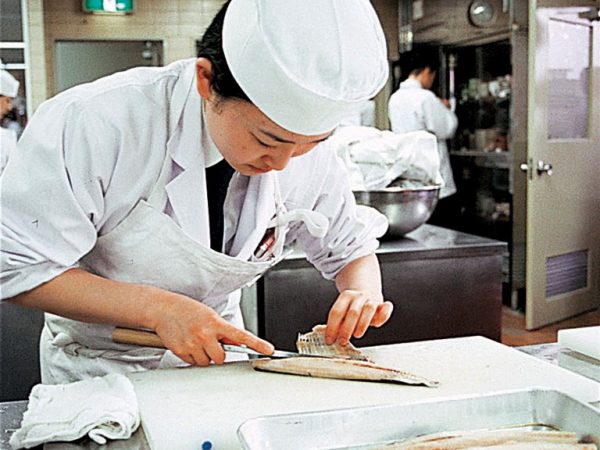 Japanese chef fileting fish